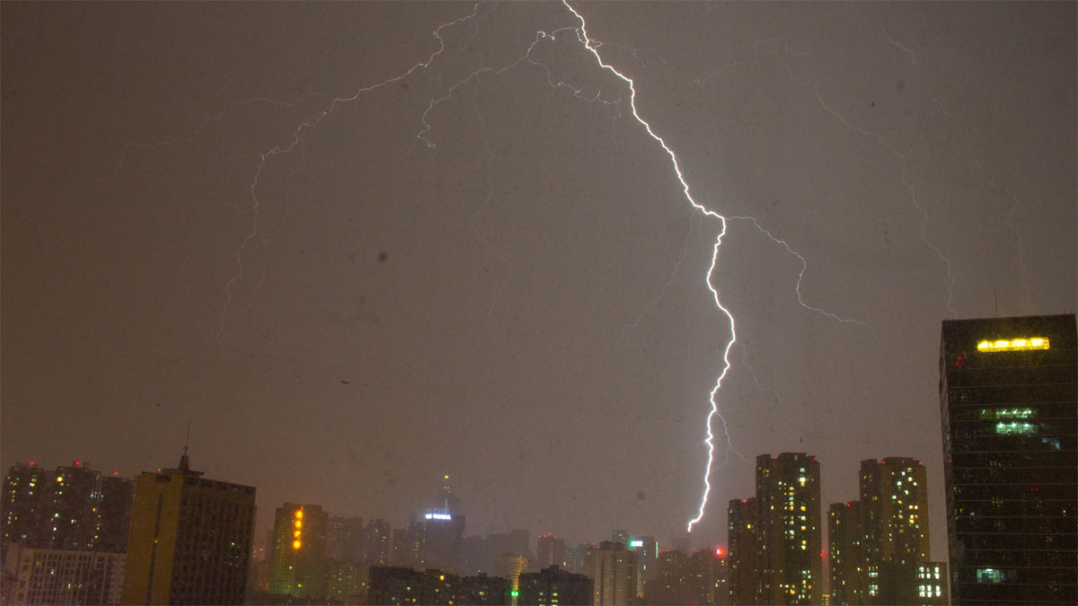 Lighting Strike Over Dark Cityscape